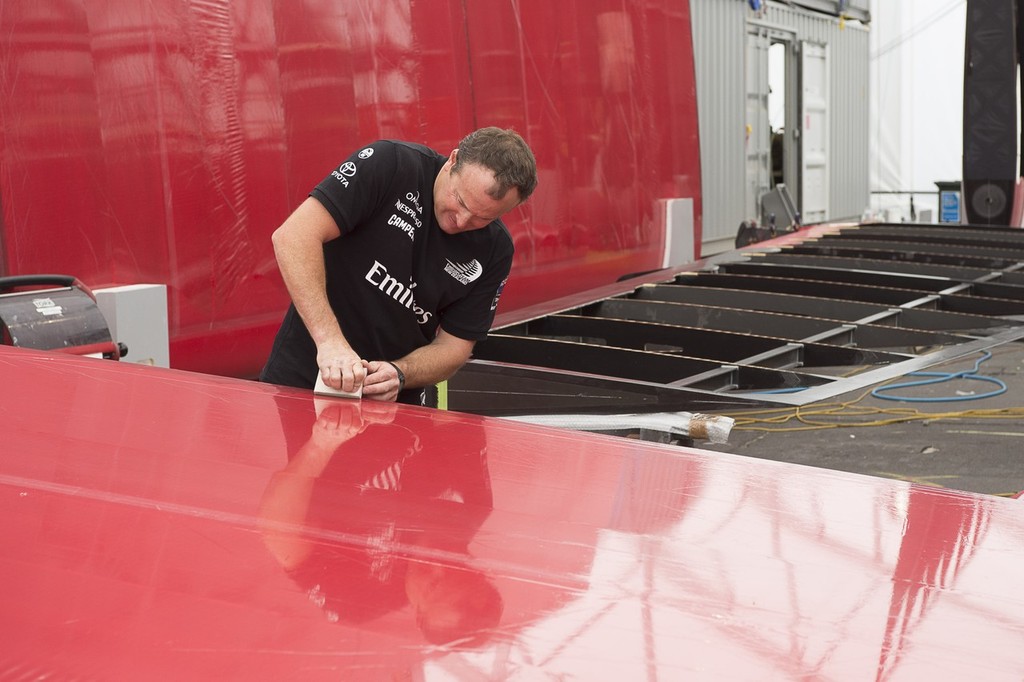 Emirates Team New Zealand, Glen Ashby works on fitting Mizar skin on to one of the flaps of Wing one. 23/1/2013 photo copyright Chris Cameron/ETNZ http://www.chriscameron.co.nz taken at  and featuring the  class