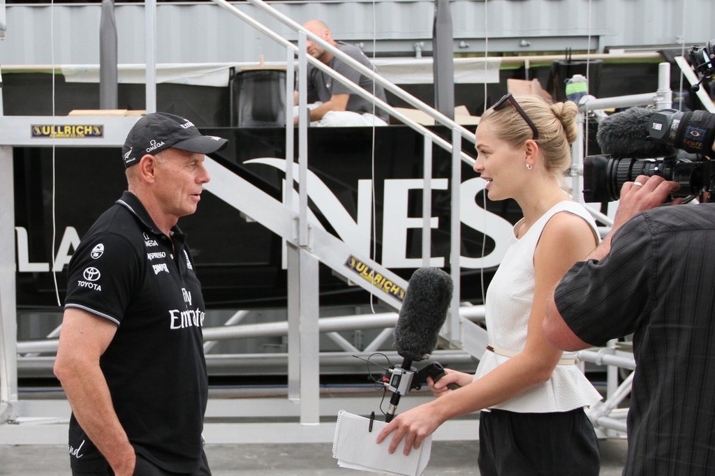 It’s a tough job but someone has to do it, Grant Dalton being interviewed for prime time TV news - Emirates Team NZ - Media Day January 17, 2012 photo copyright Richard Gladwell www.photosport.co.nz taken at  and featuring the  class