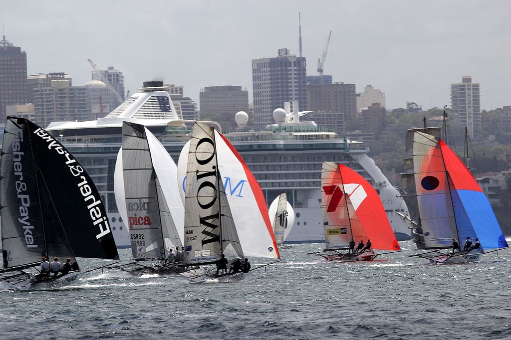 Passenger ship backgrounds the 18s Fleet - JJ Giltinan 18ft Skiff Championship 2013, Race 5 photo copyright Frank Quealey /Australian 18 Footers League http://www.18footers.com.au taken at  and featuring the  class