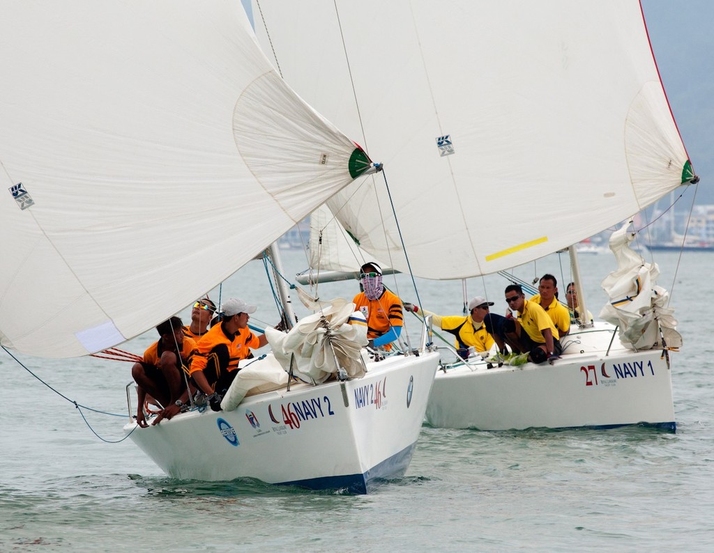 Royal Langkawi International Regatta 2013. Malaysian Tigers (MYA/KFC) working hard to stay ahead of ATM. photo copyright Guy Nowell http://www.guynowell.com taken at  and featuring the  class