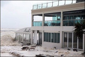 Burleigh Beach restaurant and swimming school hit by waves photo copyright Jeni Bone taken at  and featuring the  class