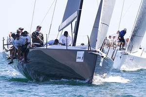 Hooligan rounds the top mark with Team Beau Geste hot on their heels - TP52 Southern Cross Cup 2013 photo copyright Teri Dodds http://www.teridodds.com taken at  and featuring the  class