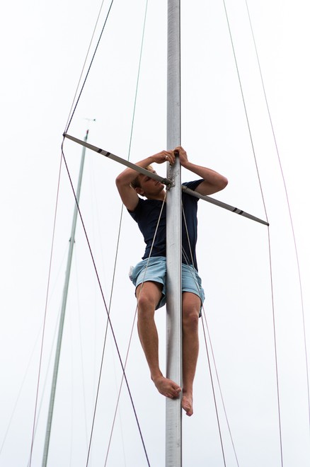Jacob Broom performs some last minute tuning tasks on the mast. - 2013 Etchells NSW Championship &copy; Kylie Wilson Positive Image