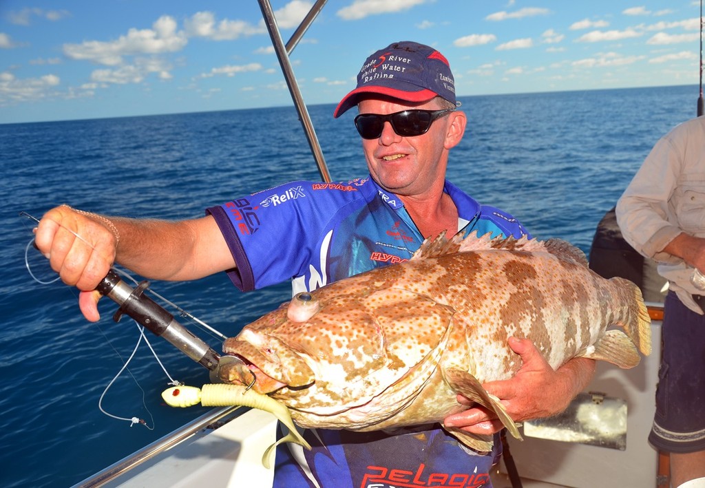 Big curl tails equal big fish!  This 8`` grub lure left Jason Horton in a world of hurt after a big cod engulfed it. photo copyright Lee Brake taken at  and featuring the  class