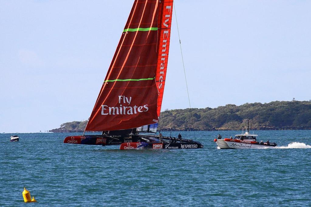 Gennaker furl starts  - Emirates Team NZ - March 2013 photo copyright Richard Gladwell www.photosport.co.nz taken at  and featuring the  class