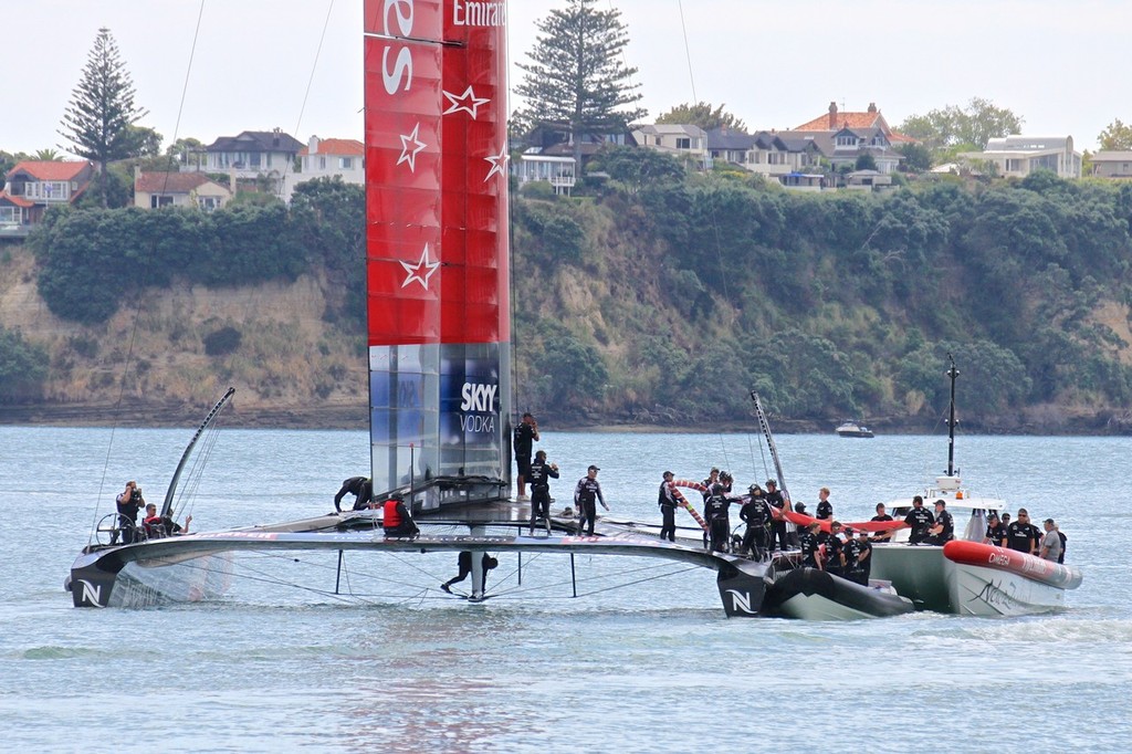 Checking out the undercarriage - Emirates Team NZ - 26 February 2013 photo copyright Richard Gladwell www.photosport.co.nz taken at  and featuring the  class