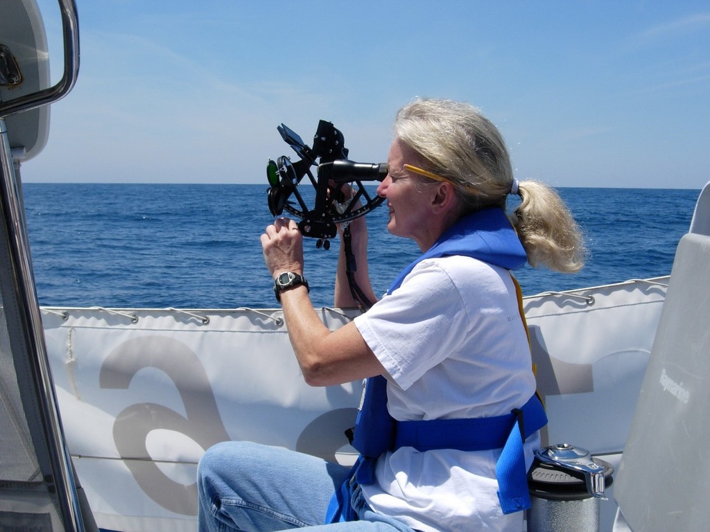 Gail Greenwald taking a sun shot during the 2005 Marion Bermuda Cruising Yacht Race  aboard the Valiant 42 Cordelia that she and her husband Roy sailed to 1st place in the Celestial Division, 1st in their class and third overall. This was her first experience as navigator in the race. photo copyright SpectrumPhoto/Fran Grenon taken at  and featuring the  class