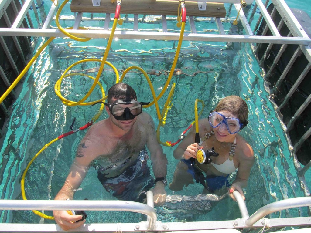 Big Game Resort Guest  Ryan Custereri from Washington D.C. and Shawn Dillon, Sarasota, Florida resident and Playboy Magazine’s Miss February 2013 test out the new cage at the docks of the Bimini Big Game Club. photo copyright John Bell taken at  and featuring the  class
