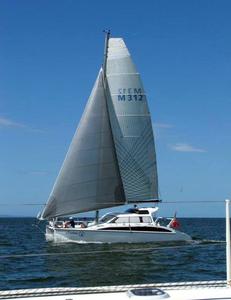 Dale Low and the Catalina crew were very relaxed and still moving well on the first leg - Allyacht Spars Brisbane to Gladstone Multihull Yacht Race photo copyright Peter Hackett taken at  and featuring the  class