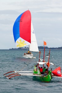 Boracay Cup Regatta 2013.  Centennial II and the Committee Boat. photo copyright Guy Nowell http://www.guynowell.com taken at  and featuring the  class