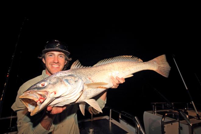 Scotty holds a respectable jewfish for the camera. © Jarrod Day