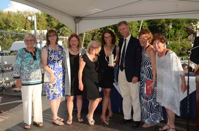 Etoile, a Stellar 52, skippered by Anne Kolker from New York, NY the Marion Bermuda Race yacht crewed entirely by females won the Ancient Mariner’s Golden Teapot Trophy for the crew having the highest average age that finishes the race. His Excellency the Governor of Bermuda Mr. George Fergusson poses with the ladies of Etoile. © Talbot Wilson