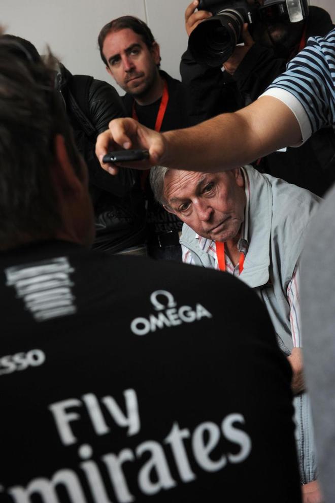 Bob Fisher trying to conduct an interview with Skipper Dean Barker from Emirates Team NZ against noise of chattering photographers.  - America’s Cup WS, Naples Media Conference April 16, 2013. ©  SW