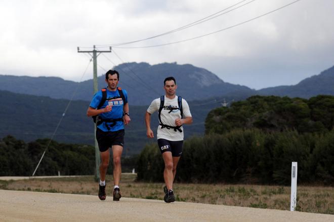 Whistler World runners Ian Franzke and Andrew McKenzie on the coast road back from Mount Strzelecki to Lady Barron - 2013 Three Peaks Race © Paul Scrambler