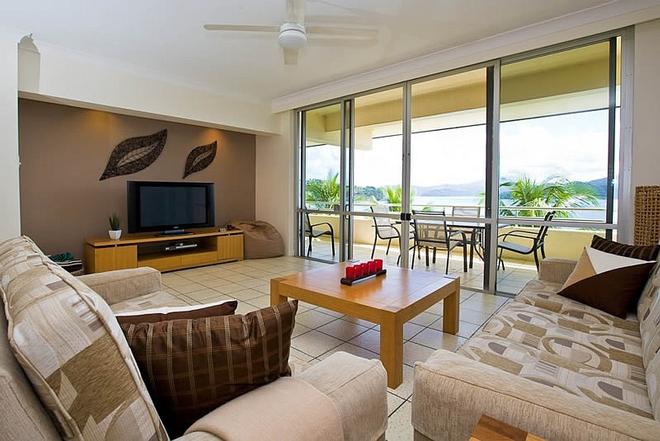 Enjoy the beautiful open plan design that Frangipani 204 offers directly opposite the beach! © Kristie Kaighin http://www.whitsundayholidays.com.au