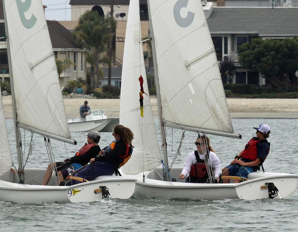 Second place finisher Jessica McJones and crew Gavin McJones (on left) fight it out with regatta winner Jacob Rosenberg and crew Madison Nadelman. photo copyright Rick Roberts  taken at  and featuring the  class