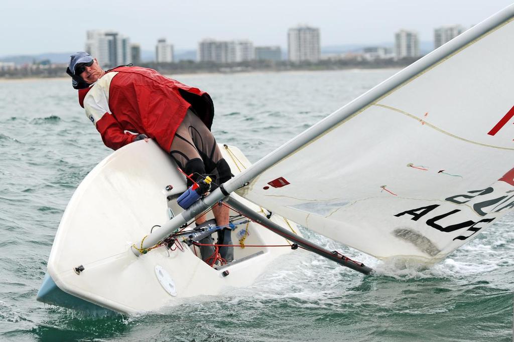Hike out there sunshine. The swell and gusty winds of Sunday tested all fleets even in the bigger kids in the Laser Standard class. - Sail Mooloolaba 2013 © Mike Kenyon http://kenyonsportsphotos.com.au/