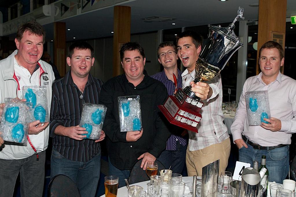 The Knee Deep crew with the spoils of victory. photo copyright Bernie Kaaks taken at  and featuring the  class