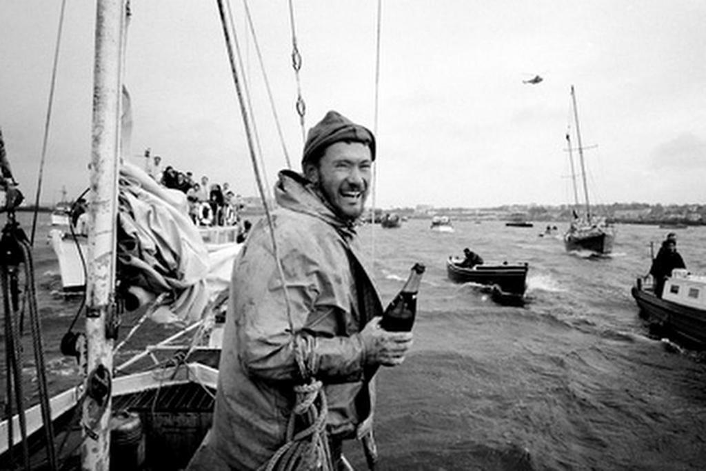 Circa 22nd April 1969: Robin Knox-Johnston celebrates aboard his 32ft yacht SUHAILI off Falmouth, England after becoming the first man to sail solo non-stop around the globe. Knox-Johnston was the sole finisher in the Sunday Times Golden Globe solo round the world race, having set out from Falmouth, England on 14th June 1968 © Bill Rowntree - PPL http://www.pplmedia.com