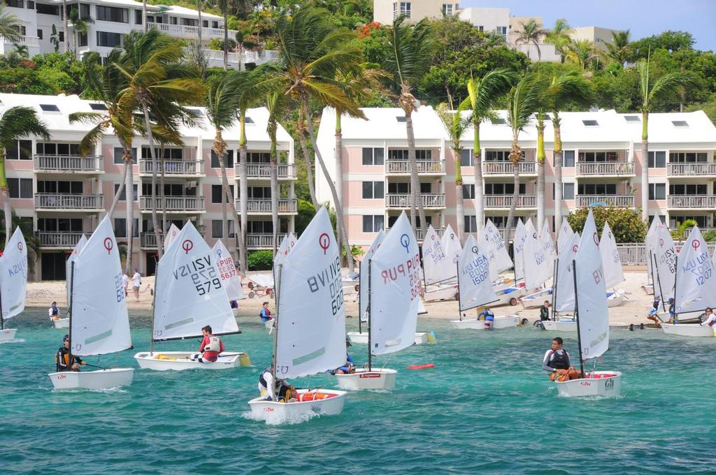 Optis leave the beach in front of St. Thomas Yacht Club. Credit: Dean Barnes - International Optimist Regatta photo copyright Dean Barnes taken at  and featuring the  class