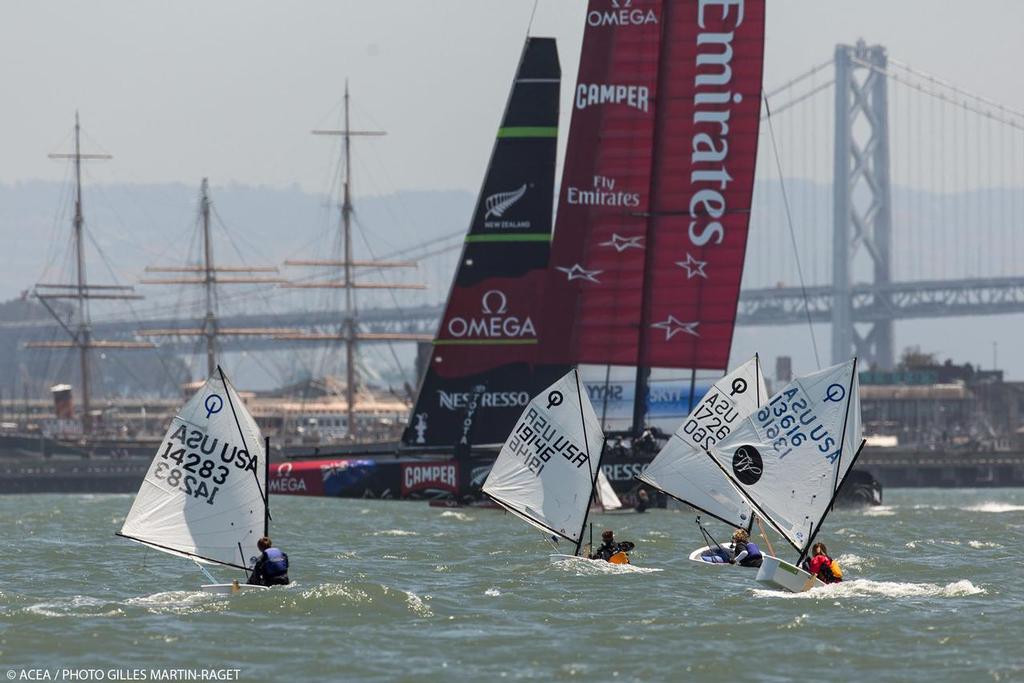 Emirates Team NZ amongst the Optimists on the Bay © ACEA/ Bob Grieser http://photo.americascup.com/