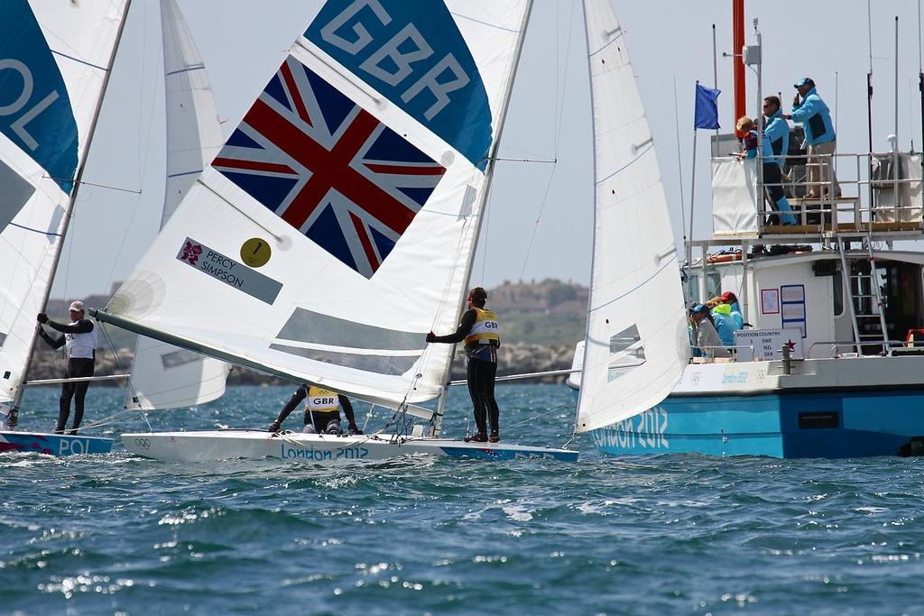 Iain Percy and Bart Simpson cross the finish line in the Medal race of the Star class in the 2012 Olympics to win the Silver Medal, having led the fleet going into the final race. photo copyright Richard Gladwell www.photosport.co.nz taken at  and featuring the  class