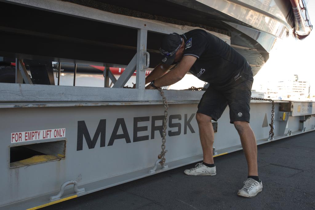 Emirates Team New Zealand, Chris Salthouse chains down a chase boat for shipping to San Francisco. 8/4/2013 © Chris Cameron/ETNZ http://www.chriscameron.co.nz