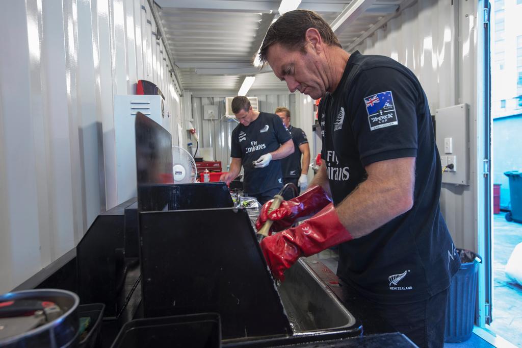 Emirates Team New Zealand, Tony Rae, Winston Macfarlane and Rob Waddell strip down winch parts for shipping to San Francisco. 8/4/2013 © Chris Cameron/ETNZ http://www.chriscameron.co.nz
