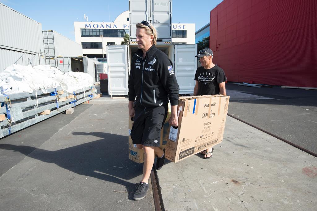 Emirates Team New Zealand packing up. Marty Yates and Joe Allen take the coaching TVs to a container. 9/4/2013 © Chris Cameron/ETNZ http://www.chriscameron.co.nz