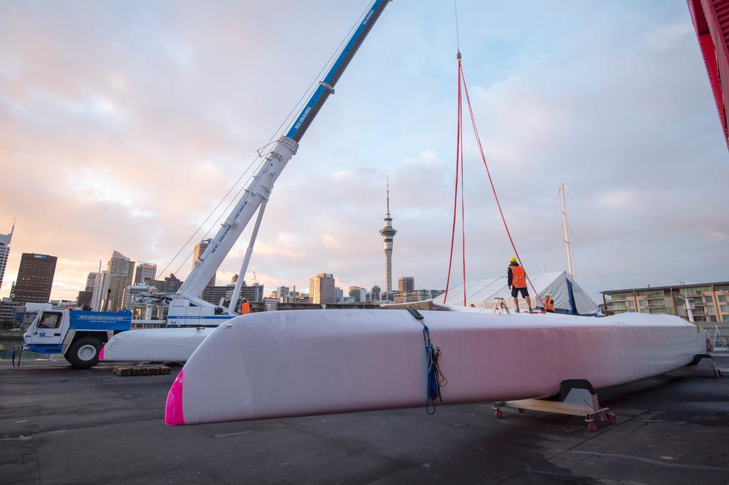 Emirates Team New Zealand AC72,  NZL5 is lifted into the water to be towed to the Maersk ship that will start its journey to San Francisco. 18/4/2013 © Chris Cameron/ETNZ http://www.chriscameron.co.nz