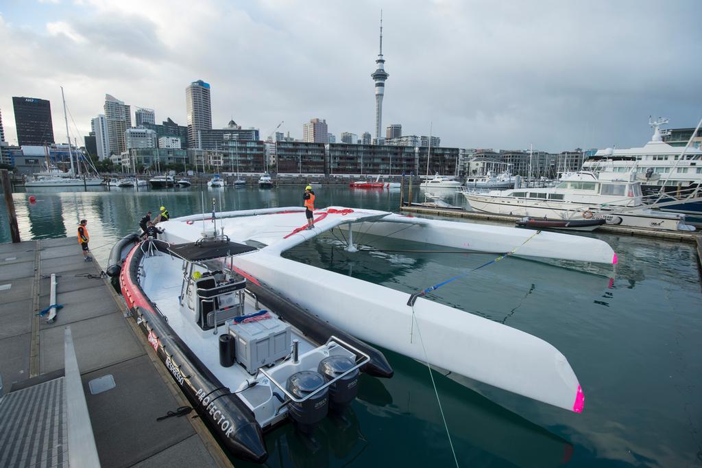 Emirates Team New Zealand AC72,  NZL5 is lifted into the water to be towed to the Maersk ship that will start its journey to San Francisco. 18/4/2013 © Chris Cameron/ETNZ http://www.chriscameron.co.nz