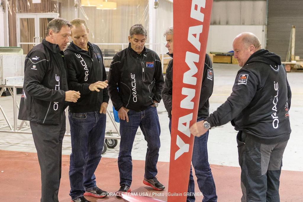 Larry Ellison is shown the the rudder elevators on Oracle Team USA during a visit on March 4, 2013 photo copyright Guilain Grenier Oracle Team USA http://www.oracleteamusamedia.com/ taken at  and featuring the  class