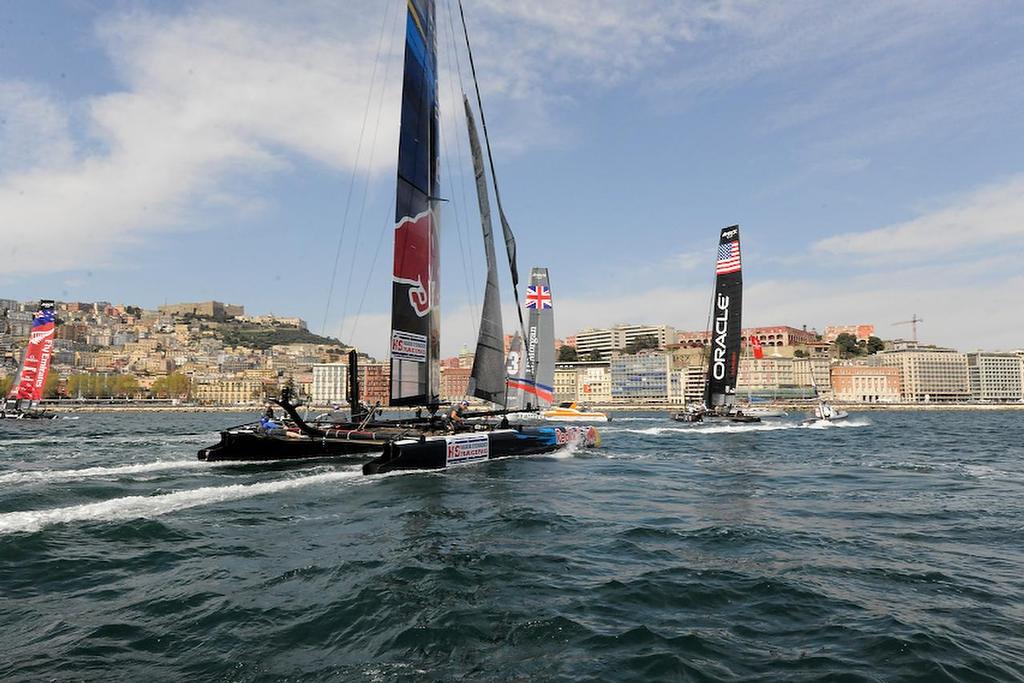 AC45 boats are traveling at speeds of 25 or more knots going toward the leeward gate at an official practice race on the Bay of Napoli in Italy on April17, 2013.  ©  SW