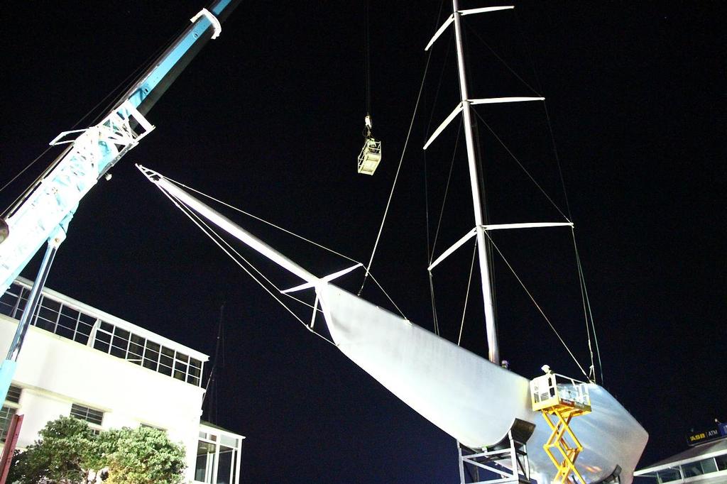 A crane lifts the crew skywards to attach lifting strops to the spar - KZ-1 Mast removal July 1, 2013 photo copyright Richard Gladwell www.photosport.co.nz taken at  and featuring the  class