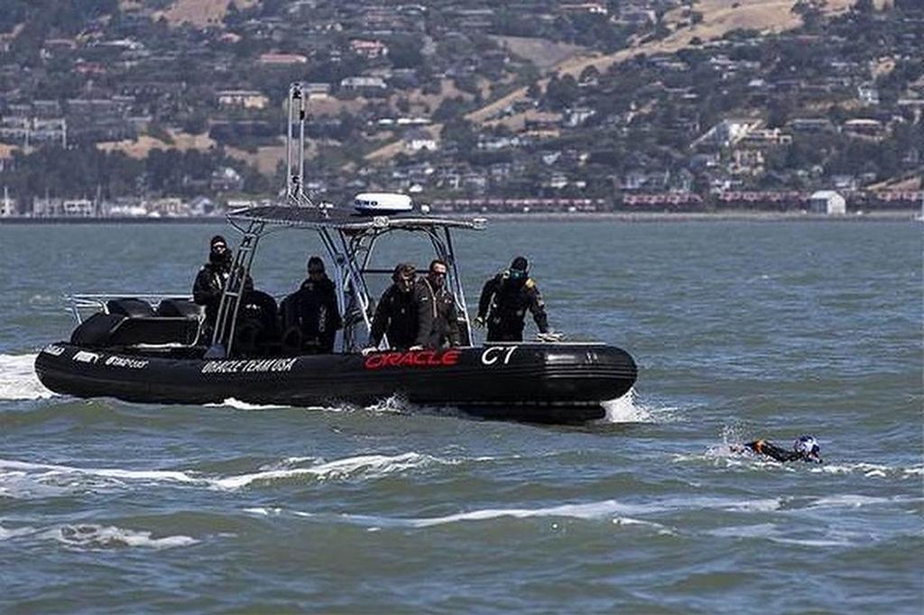 Expanded image - Jimmy Spithill swimming in San Francisco Bay photo copyright Oracle Team USA http://www.oracleteamusa.com taken at  and featuring the  class