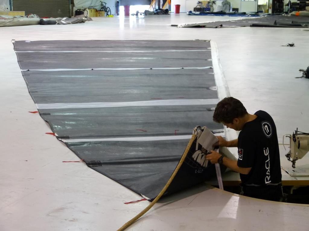 Working on a jib in the sail loft - Oracle Team USA - Media Tour July 3, 2013 © John Navas 