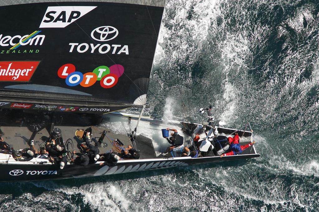 Team New Zealand crewman bailing the massive amount of water in the back of the boat during Race 1 of the 2003 America’s Cup - the opening stanza in what proved to be one of New Zealand’s biggest sporting disasters - photo © Ivor Wilkins/www.americascup.com www.americascup.com