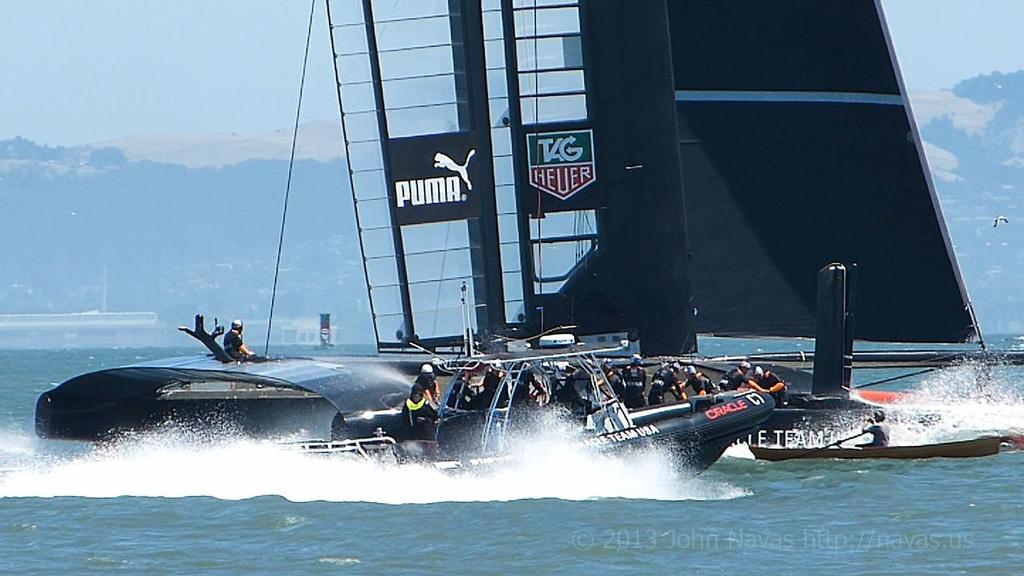 A kayaker gets too close to the AC72’s - action from San Francisco Bay - 34 America’s Cup practice sessions © John Navas 