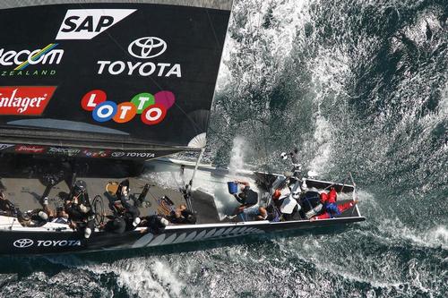 Team New Zealand crewman bailing the massive amount of water in the back of the boat during Race 1 of the 2003 America’s Cup - the opening stanza in what proved to be one of New Zealand’s biggest sporting disasters © Ivor Wilkins/www.americascup.com www.americascup.com