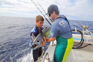 Gently releasing the fish after the tagging process. photo copyright Jarrod Day taken at  and featuring the  class