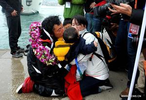 Guo Chuan - first Chinese solo non-stop circumnavigator - arrives home in Qingdao photo copyright Xinhua - China Daily taken at  and featuring the  class