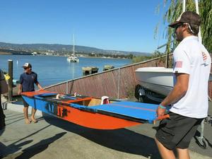 Carrying the finished boat to the water.  Solomon Krevan and Ian Andrewes, American Youth Sailing Force photo copyright Kim Paternoster taken at  and featuring the  class