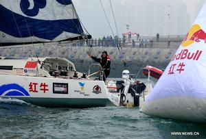 Guo Chuan - first Chinese solo non-stop circumnavigator - arrives home in Qingdao photo copyright Xinhua - China Daily taken at  and featuring the  class