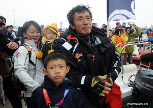 Guo Chuan - first Chinese solo non-stop circumnavigator - arrives home in Qingdao photo copyright Xinhua - China Daily taken at  and featuring the  class