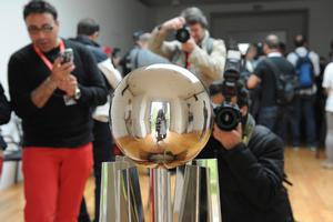 The ACWS trophy is the focus and everyone is keeping their eye on the ball to get it, even the photographers   - America’s Cup WS, Naples Media Conference April 16, 2013. photo copyright  SW taken at  and featuring the  class