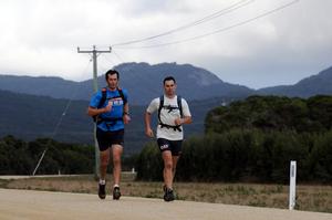 Whistler World runners Ian Franzke and Andrew McKenzie on the coast road back from Mount Strzelecki to Lady Barron - 2013 Three Peaks Race photo copyright Paul Scrambler taken at  and featuring the  class