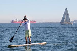 Everyone came out to watch the NMWS, including this Stand up Paddleboarder. - Nautilus Marine Winter Series photo copyright  Alex McKinnon Photography http://www.alexmckinnonphotography.com taken at  and featuring the  class