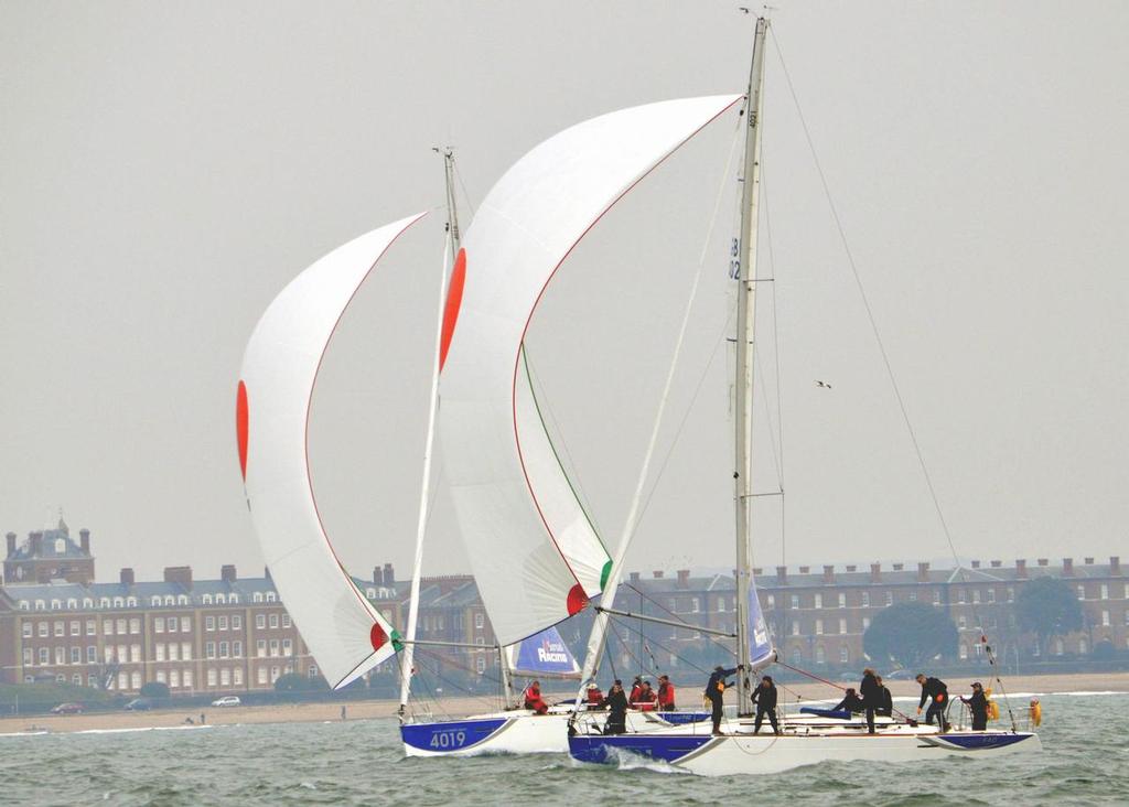 Nearest the shore, Ed Harrison, competing in his 17th and last BUSA event and helming Durham Blue to fourth overall, with Southampton Solent Black (Jack Holden) in the foreground                  © Sean Clarkson - British University Yachting Championships 2013 photo copyright Sean Clarkson taken at  and featuring the  class