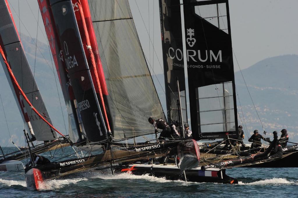 Emirates Team New Zealand aproaches the windward gate behind Energy Team and finished third and fourth in the second fleet race on the first day of racing at the ACWS in Naples Italy April 8, 2013.   ©  SW