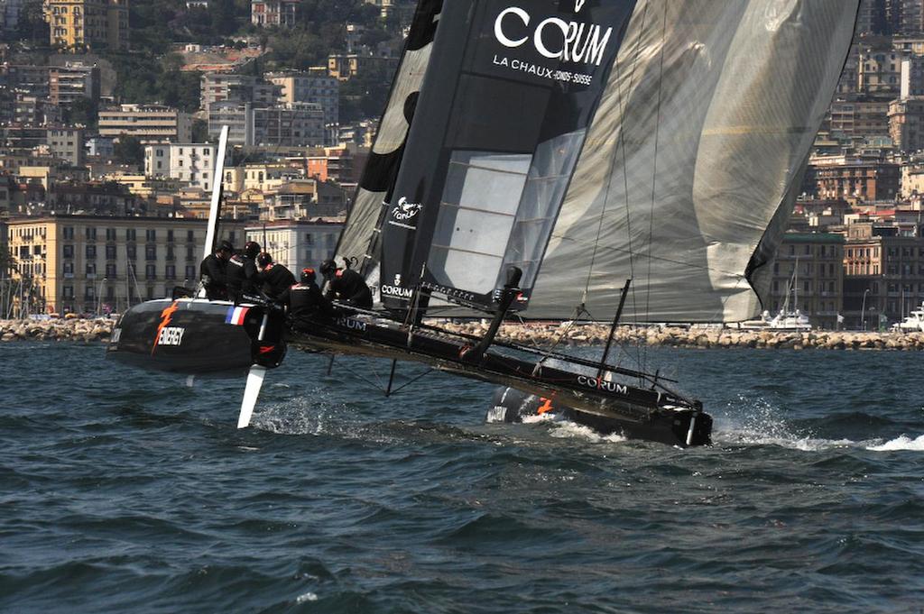 Energy Team flies down the racing course to place second  overall for the day of racing at the ACWS on the Bay of Napoli in Italy April 19, 2013.   ©  SW
